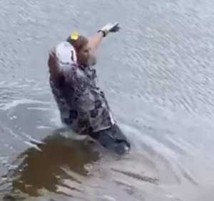 Golfer sending it in the water